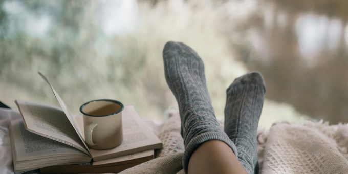 Remembering dreams – woman with morning coffee at window