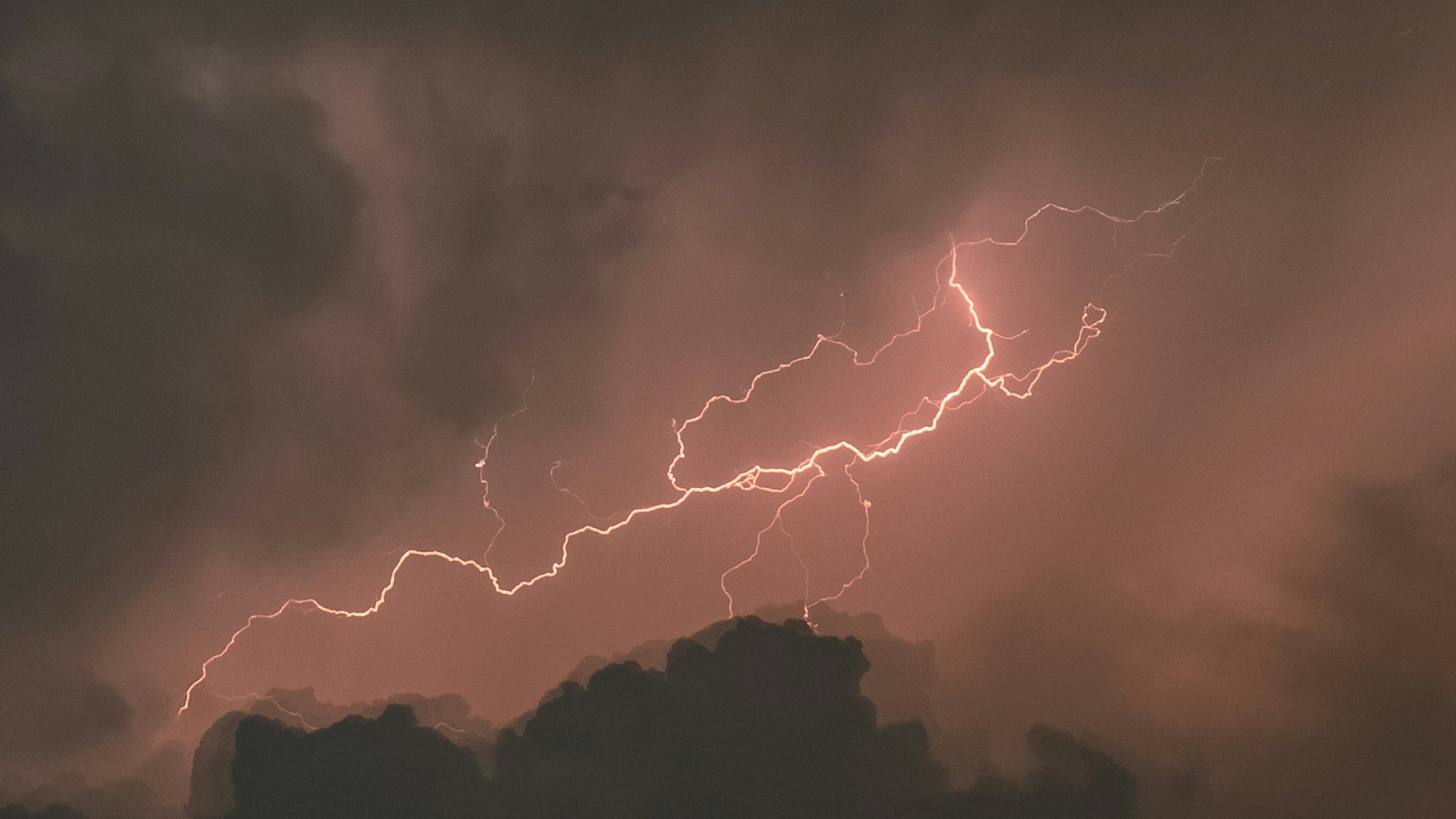 Lightning illuminating storm clouds – a flash of knowledge from darkness