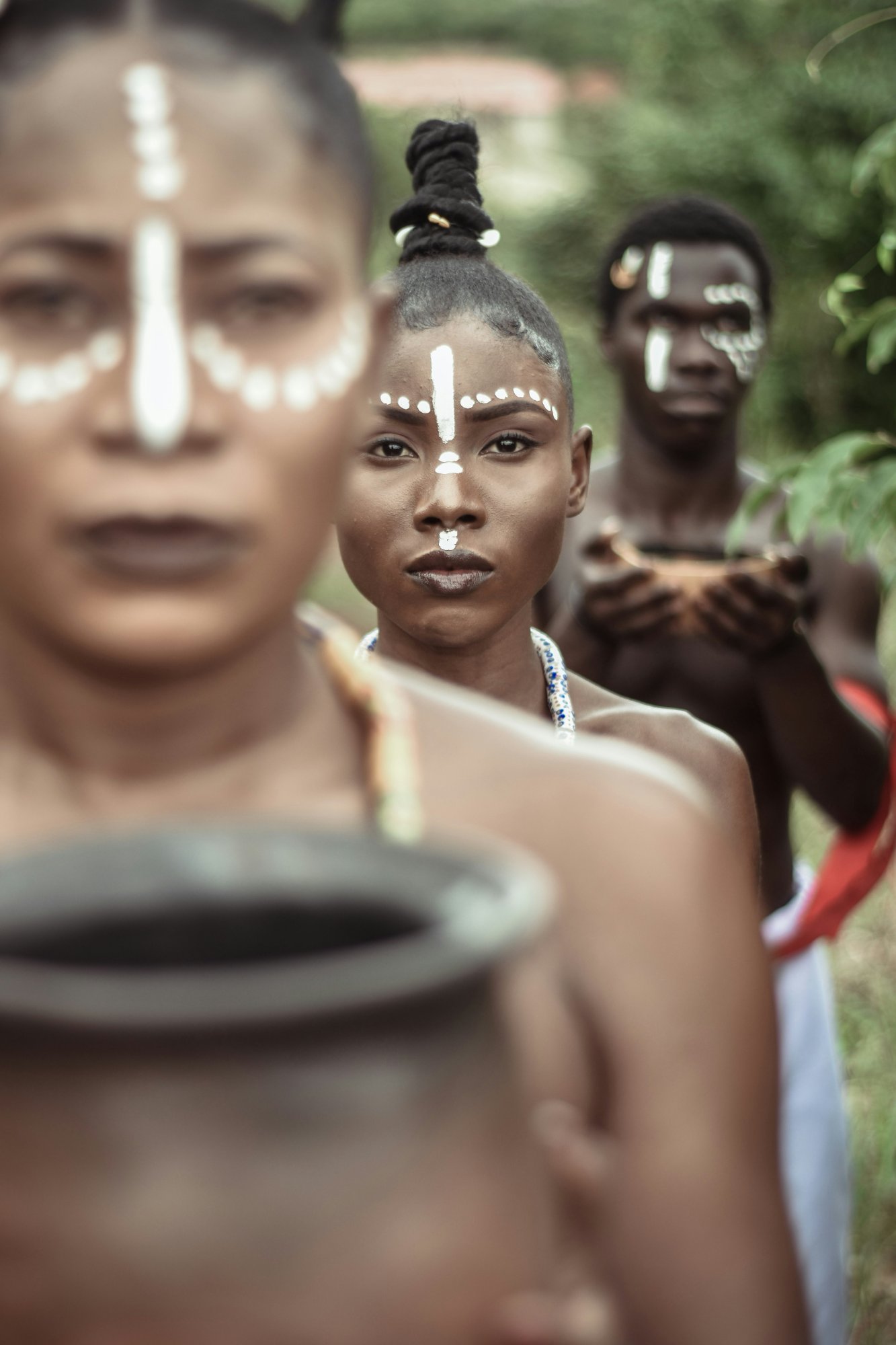 Ceremonial figures with ritual face paint – the bridge between worlds