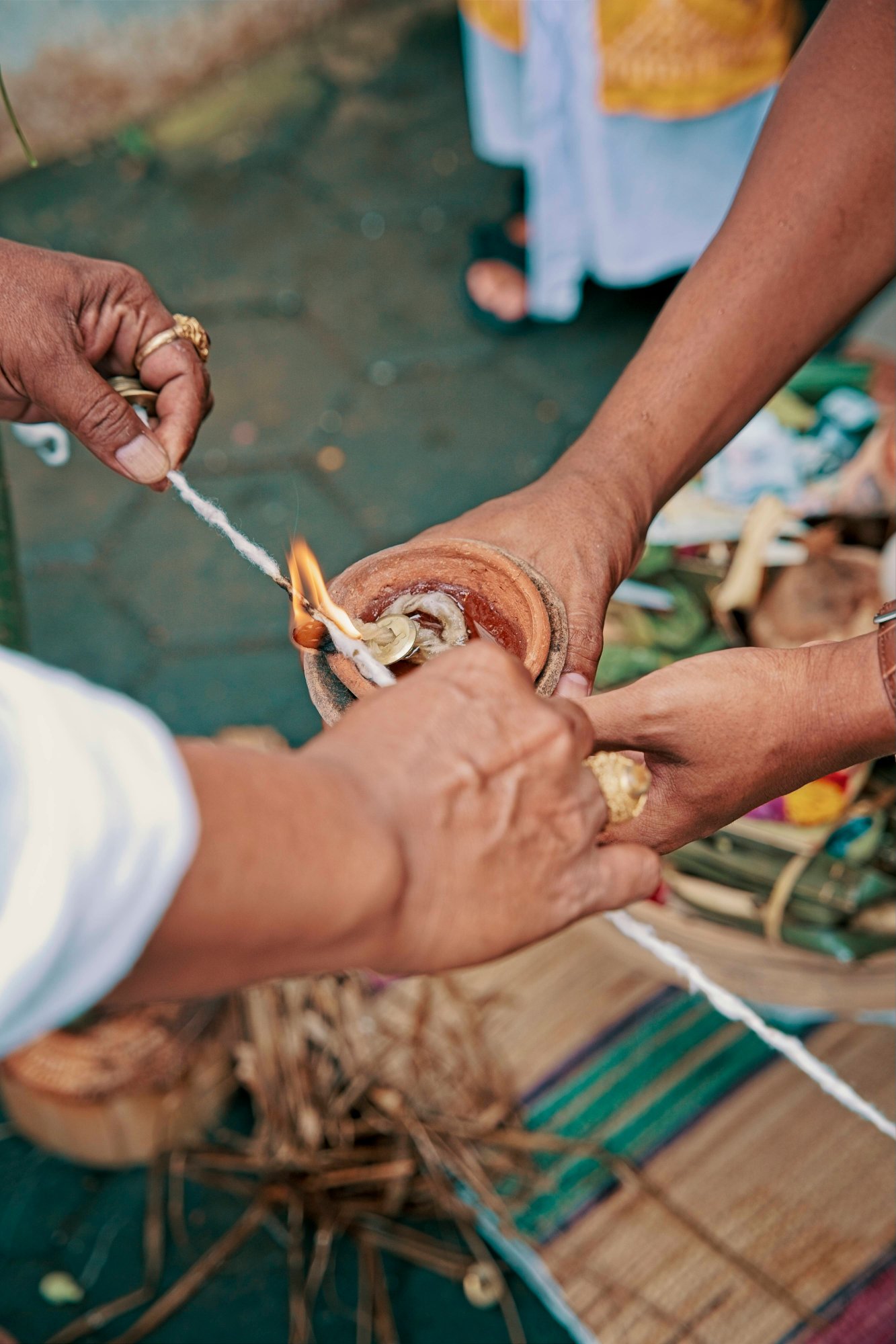 Ritual fire ceremony with hands performing a spiritual offering